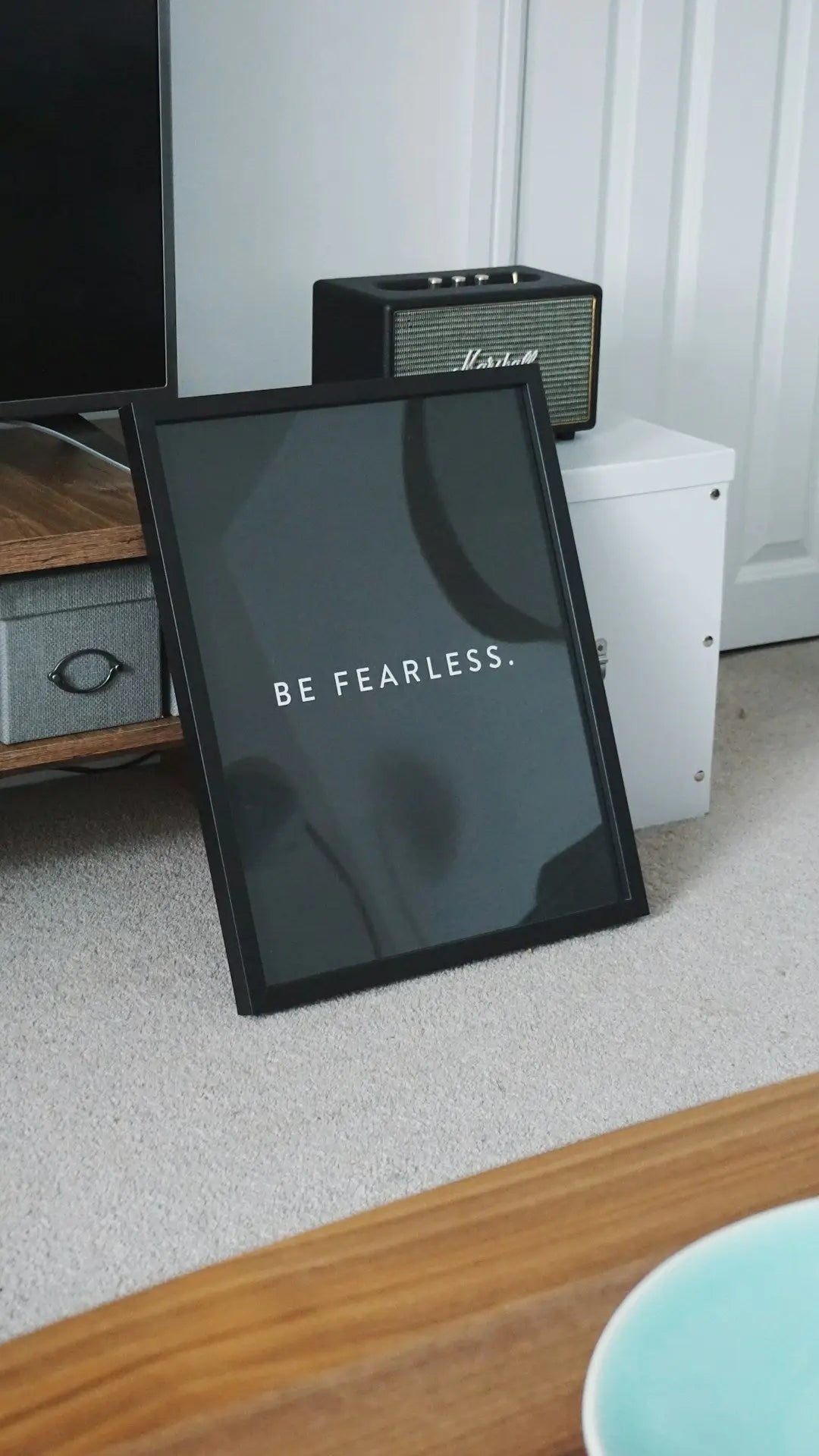 Framed motivational print with BE FEARLESS text on dark background for custom framing ideas.