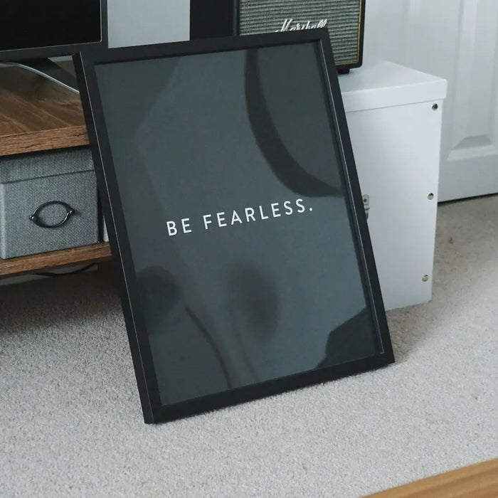 Framed BE FEARLESS print showcasing modern memory design on dark background.