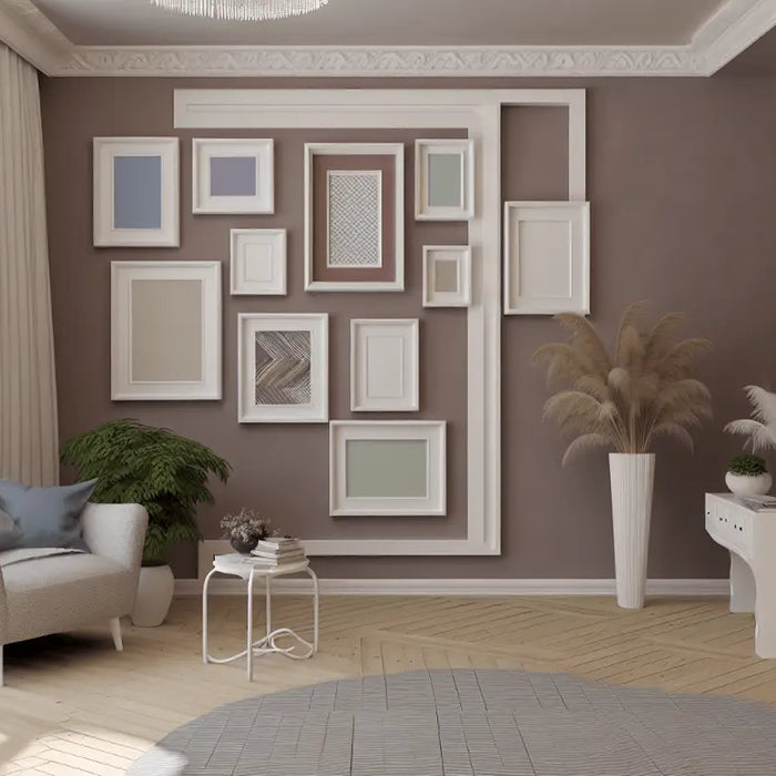 Gallery wall with multiple empty white picture frames arranged on a brown wall.